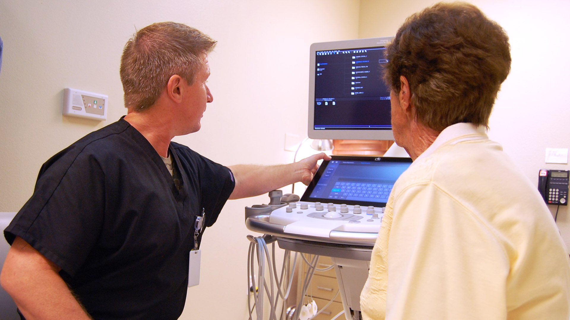 Ultrasound tech at CCMC Health System with a patient